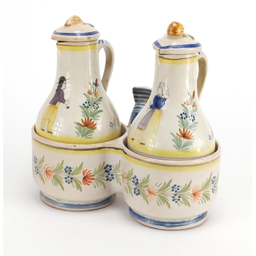 539 - French Quimper pottery oil and vinegar cruet, the bottles hand painted with a traditional lady and g... 