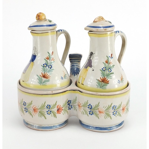 539 - French Quimper pottery oil and vinegar cruet, the bottles hand painted with a traditional lady and g... 