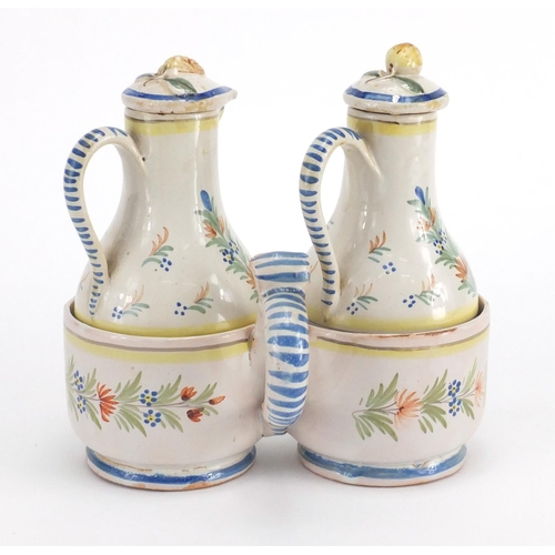 539 - French Quimper pottery oil and vinegar cruet, the bottles hand painted with a traditional lady and g... 