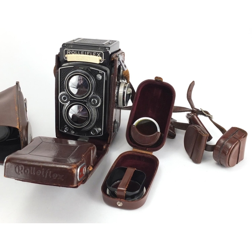 125 - Rolleiflex twin lense camera by Franke and Heidecke, with accessories, serial numbered 1746177