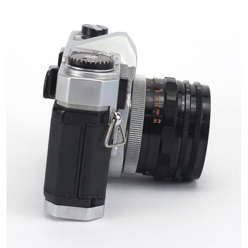 128 - Canonflex RM camera with Super-Canon lense and accessories including a Minox monocular, the camera w... 