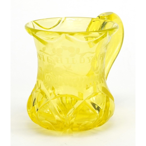 548 - Victorian yellow cut glass beaker engraved Minnie Hildyard, 9.5cm high