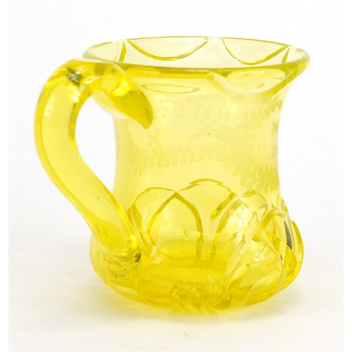 548 - Victorian yellow cut glass beaker engraved Minnie Hildyard, 9.5cm high