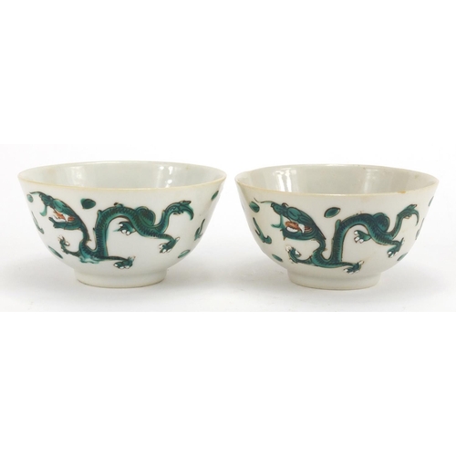 348 - Pair of Chinese porcelain bowls, both hand painted in the famille verte palette with dragons amongst... 