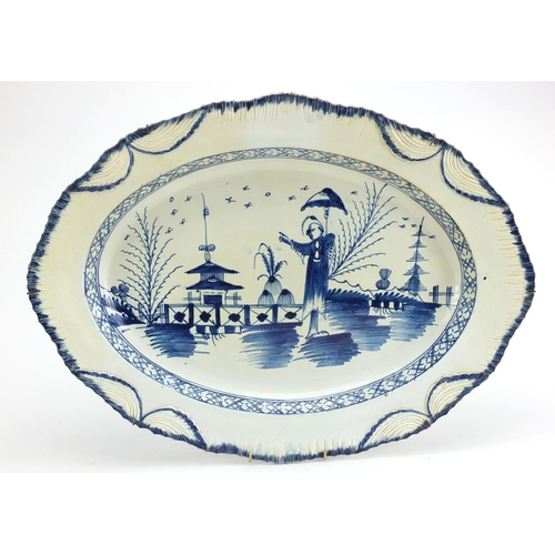 505 - 18th century pearlware meat plate hand painted with an oriental lady in a Chinese landscape, 52cm wi... 