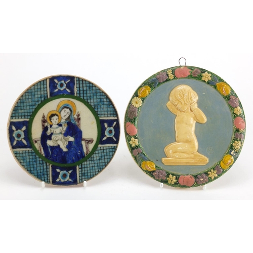 541 - Circular stoneware wall plaque hand painted with Madonna and Child together with a plaster example, ... 