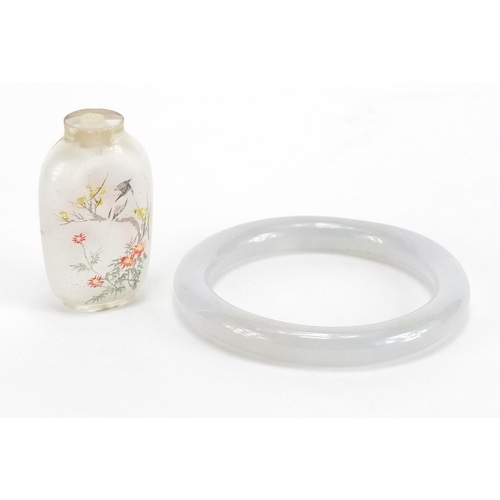 434 - Chinese white jade bangle together with a glass scent bottle, the interior hand painted with birds o... 