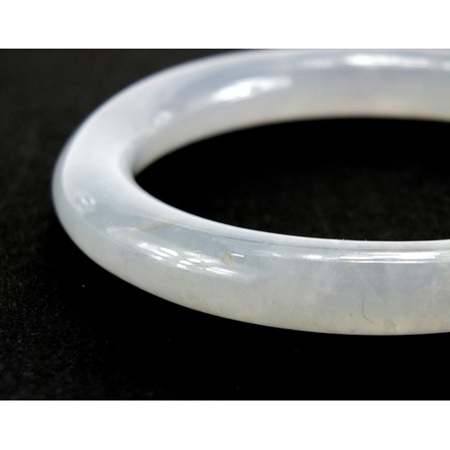 434 - Chinese white jade bangle together with a glass scent bottle, the interior hand painted with birds o... 