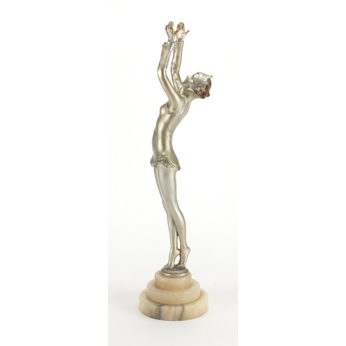 598 - Art Deco silvered metal study of a performer, raised on a circular stepped onyx base, 39cm high