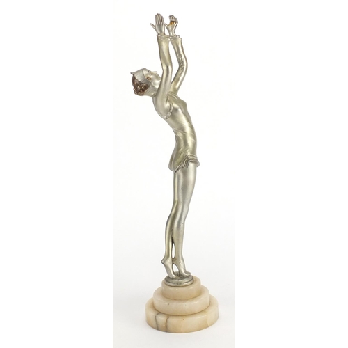 598 - Art Deco silvered metal study of a performer, raised on a circular stepped onyx base, 39cm high