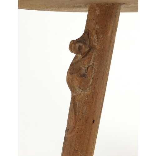 616 - Oak three legged stool, with floral carved top and carved mouse to one of the legs, 23cm high x 27cm... 