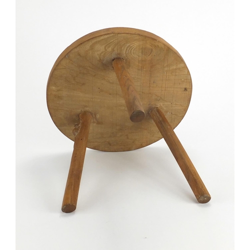 616 - Oak three legged stool, with floral carved top and carved mouse to one of the legs, 23cm high x 27cm... 