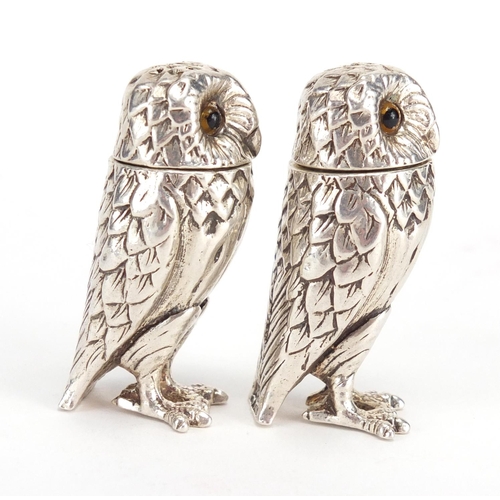 647 - Pair of novelty silver salt and pepper shakers, in the form of owls with glass eyes, P.J.M Birmingha... 