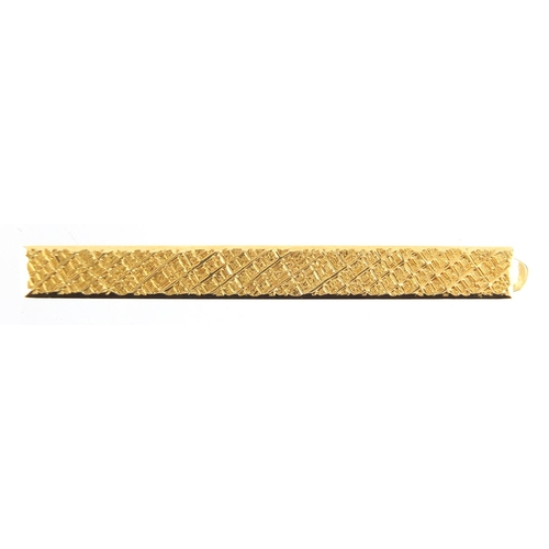 714 - 18ct gold Cartier tie slide, numbered L8766, 6cm in length, approximate weight 9.0g