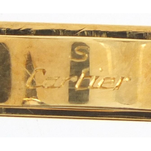 714 - 18ct gold Cartier tie slide, numbered L8766, 6cm in length, approximate weight 9.0g