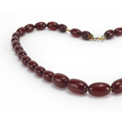 789 - Cherry amber coloured bead necklace, 42cm in length, approximate weight 19.2g