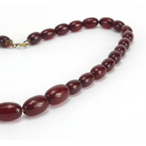 789 - Cherry amber coloured bead necklace, 42cm in length, approximate weight 19.2g