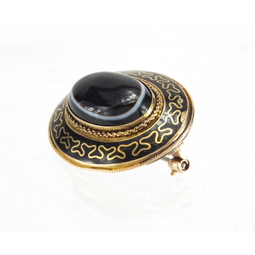 735 - Victorian unmarked gold black enamel mourning brooch, set with a Cabochon Agate stone, 3.5cm in leng... 