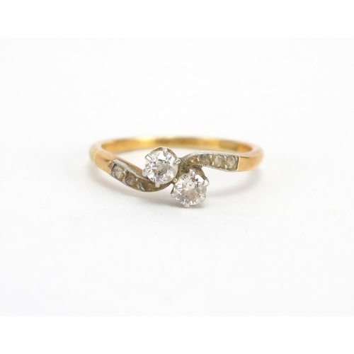 727 - 18ct gold Diamond crossover ring, size M, approximate weight 2.5g