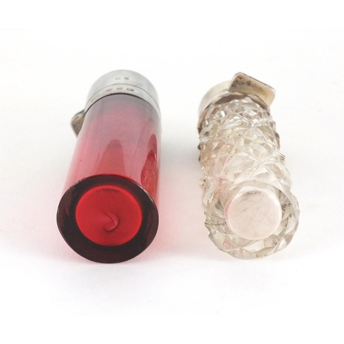 42 - Victorian Cranberry glass silver topped scent bottle with silver lid and one other, hallmarked Birmi... 