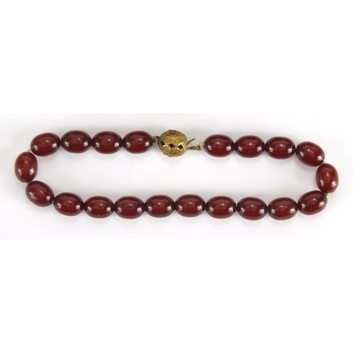 787 - Cherry amber coloured bead necklace and bracelet, the necklace, 60cm in length, approximate weight 5... 