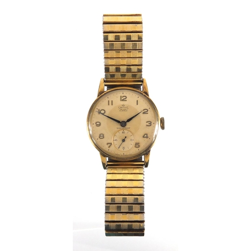 816 - Gentleman's 9ct gold Smiths Deluxe wristwatch with subsidiary dial, 3cm in diameter, with box and re... 