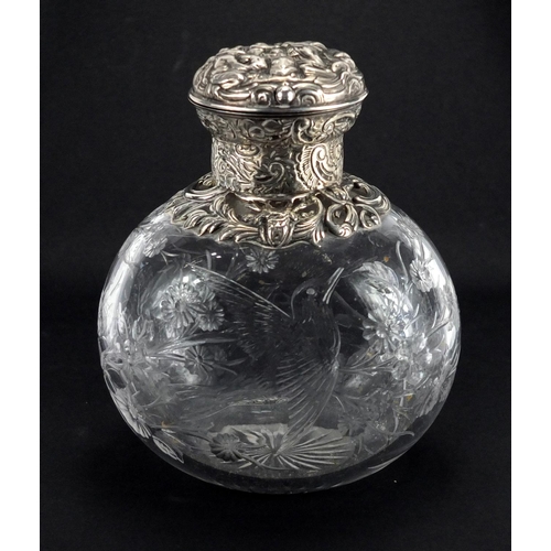 36 - Victorian silver topped Webb rock crystal scent bottle carved with a bird amongst flowers, the silve... 