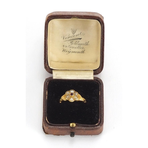 732 - Antique unmarked gold seed pearl and garnet flower head ring, size I, approximate weight 2.2g