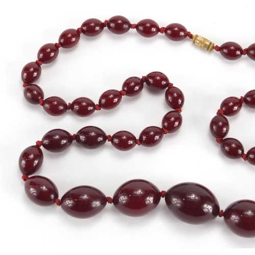 786 - Cherry amber coloured bead necklace, 70cm in length, approximate weight 60.0g