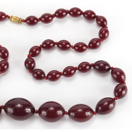 786 - Cherry amber coloured bead necklace, 70cm in length, approximate weight 60.0g