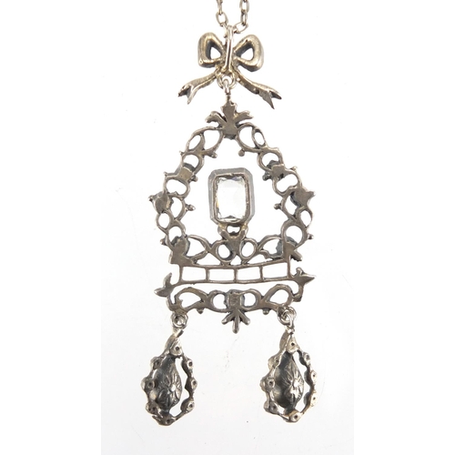 766 - Antique silver and paste pendant on chain, housed in an Emanuel goldsmith and diamond merchant South... 