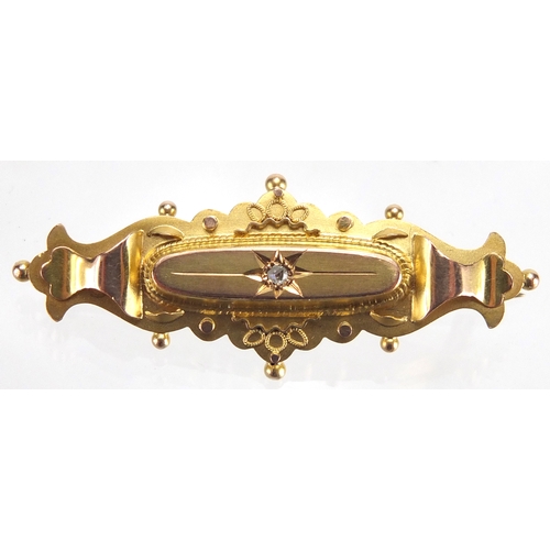 754 - 9ct gold Victorian style mourning brooch set with a diamond, 4.5cm in length