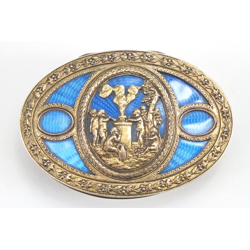 27 - Oval 800 grade silver box, the hinged lid with blue guilloche enamel and decorated with cherubs, 8cm... 