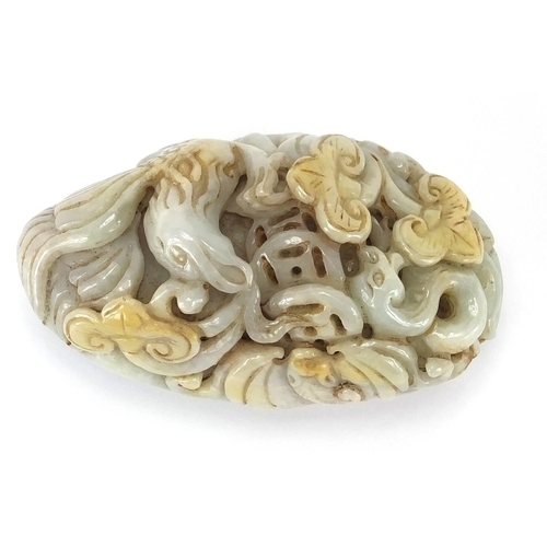 429 - Chinese white jade touch stone carved with a bird of Paradise and a bat, 8.5cm high