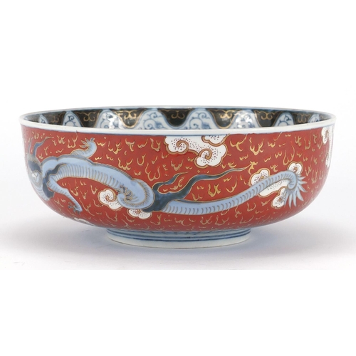 388 - Japanese Imari porcelain bowl, hand painted with Phoenixes and dragons amongst clouds, character mar... 