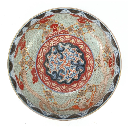 388 - Japanese Imari porcelain bowl, hand painted with Phoenixes and dragons amongst clouds, character mar... 