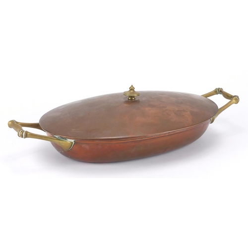 607 - Benson copper and brass lidded tureen with twin handles, stamped Benson to the base, 37cm wide