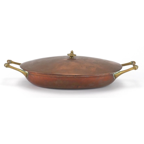 607 - Benson copper and brass lidded tureen with twin handles, stamped Benson to the base, 37cm wide