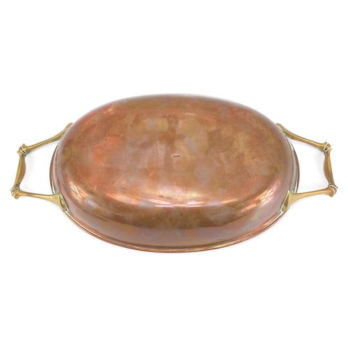 607 - Benson copper and brass lidded tureen with twin handles, stamped Benson to the base, 37cm wide