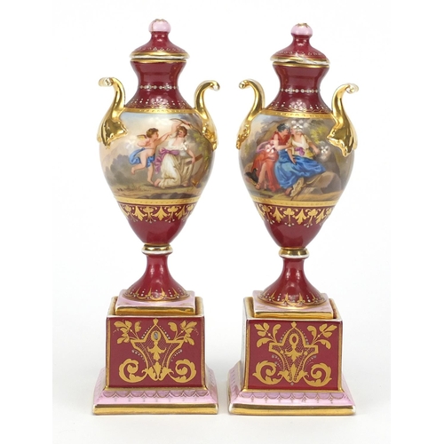 531 - Pair of 19th century Vienna porcelain urn vases and covers, each hand painted with classical figures... 