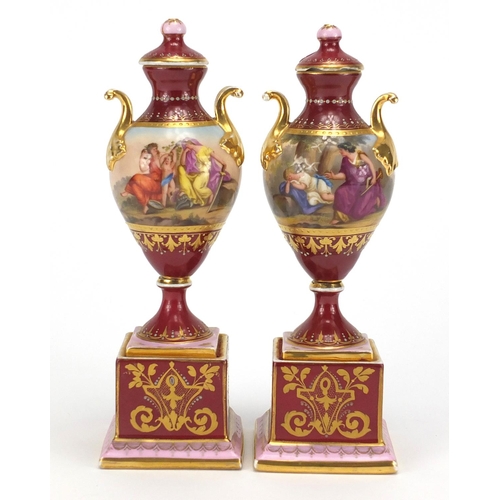 531 - Pair of 19th century Vienna porcelain urn vases and covers, each hand painted with classical figures... 