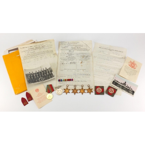268 - British Military World War II Naval medal group, black and white photographs and related ephemera, r... 