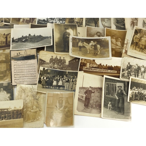 199 - Predominantly First World War and Social history postcards, some black and white including house fro... 