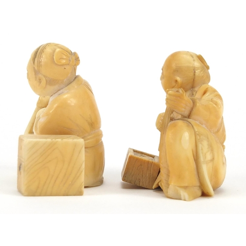 447 - Pair of Japanese carved ivory Okimono's, both of seated workers, each 5cm high