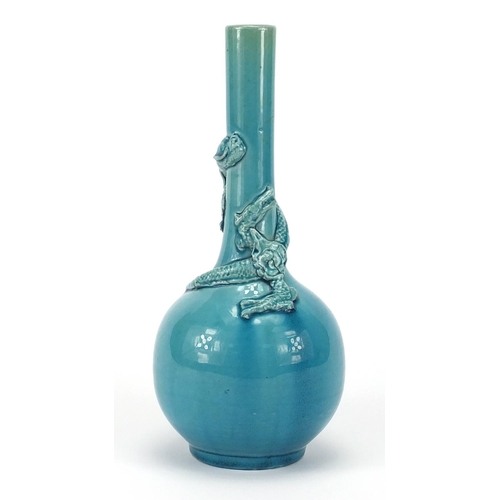 385 - Chinese turquoise glazed bottle vase, decorated in relief with a dragon, 20.5cm high