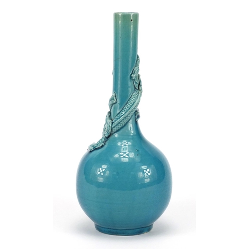 385 - Chinese turquoise glazed bottle vase, decorated in relief with a dragon, 20.5cm high