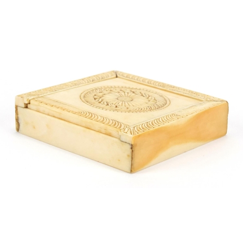 438 - Chinese Canton ivory puzzle box, the slide off lid carved with foliate motifs, the box 6.5cm x 6.5cm