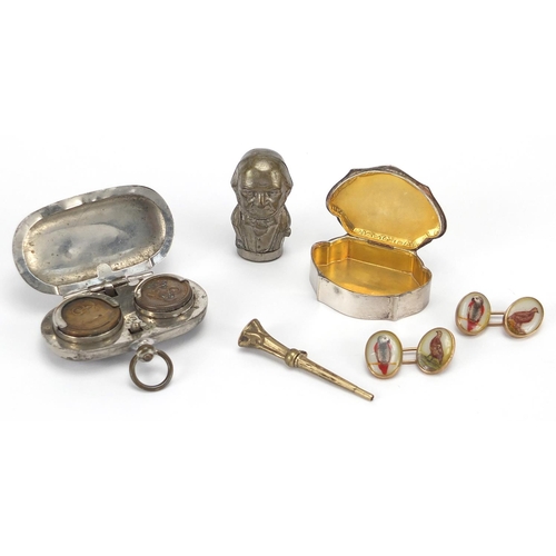 35 - Miscellaneous objects including an 800 grade silver pill box, double sovereign case and figural vest... 