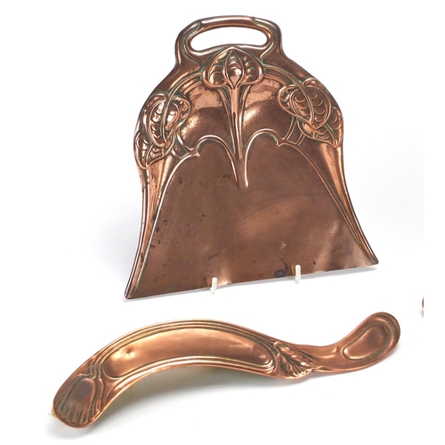 610 - Arts & Crafts copper comprising two hand brushes and two trays, embossed and engraved with stylised ... 