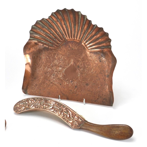 610 - Arts & Crafts copper comprising two hand brushes and two trays, embossed and engraved with stylised ... 